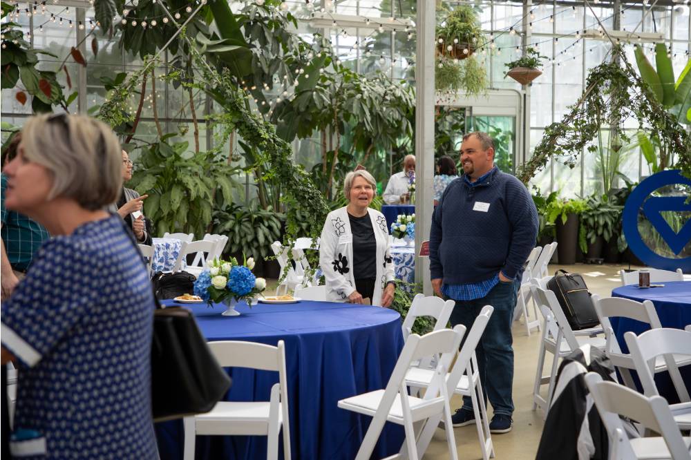 Ben Rapin and Claudia Bajema standing at event, chatting